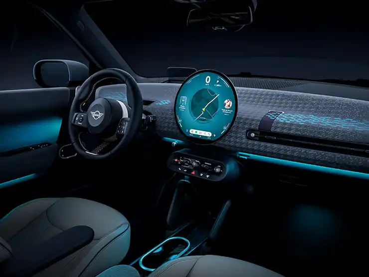 Interior view of the all-electric MINI Cooper with ambient light in blue.