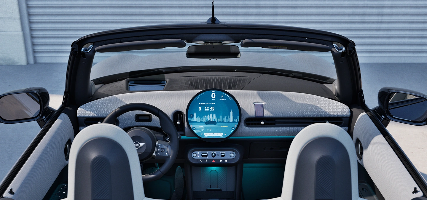 Rear view of the MINI Cooper Convertible interior with focus on the dashboard and the interaction unit.