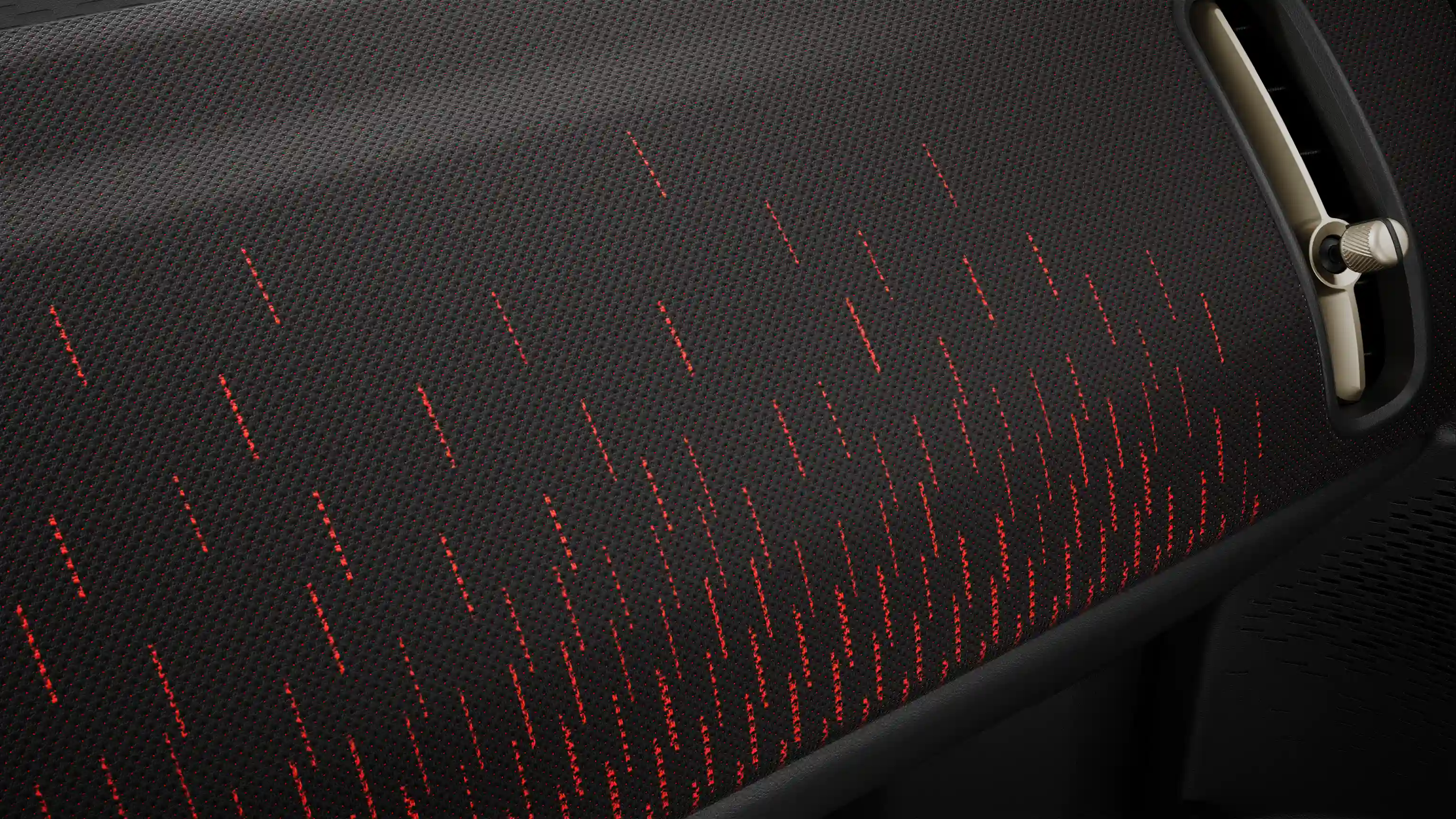 View of the all-electric MINI Countryman JCW Style dashboard in red and black