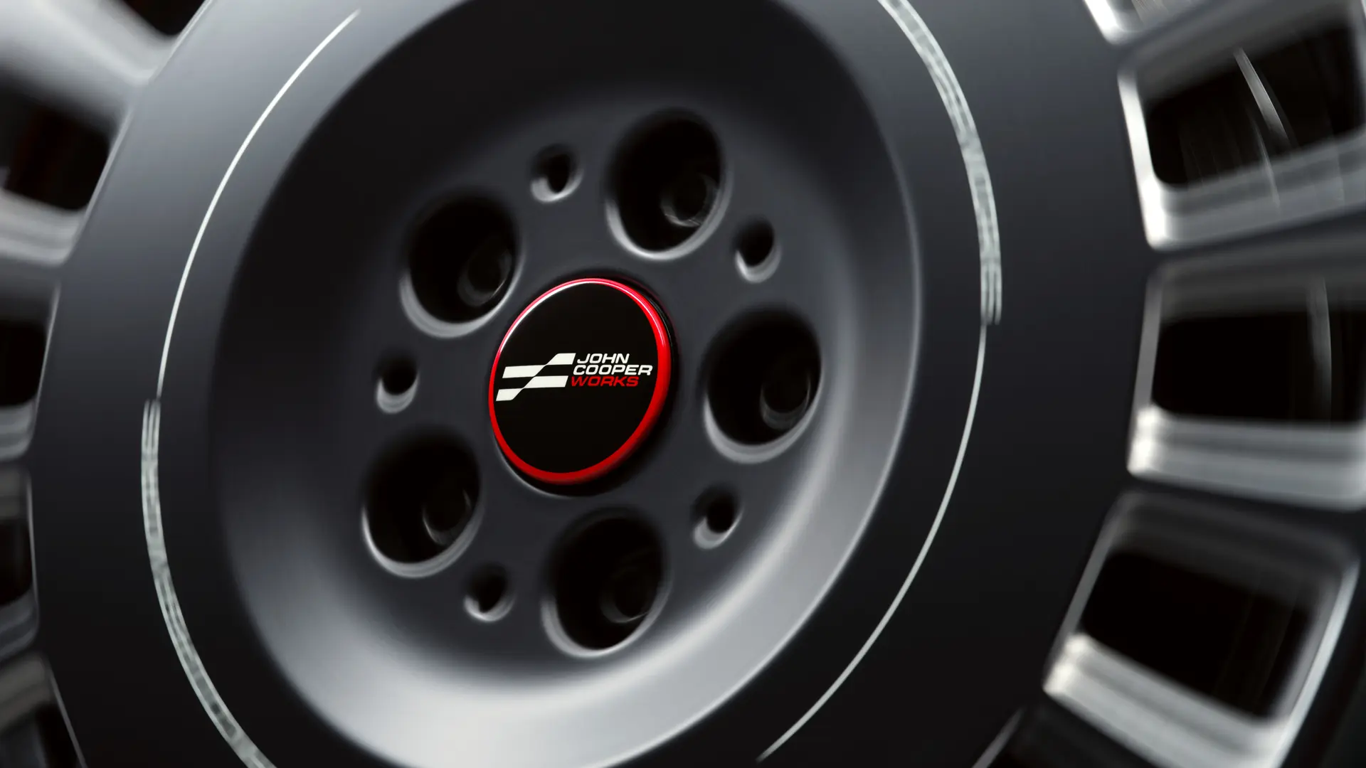 JCWのフローティング・ハブ・キャップ。ホイールが回ってもエンブレムが水平を維持するように設計されています。