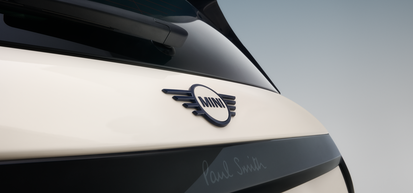 Close shot of the rear wing emblem of the all-electric MINI Cooper Paul Smith Edition in Inspired White.